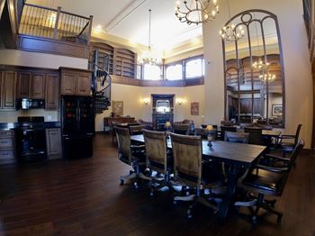 Creekside common room dining room with a table and chairs